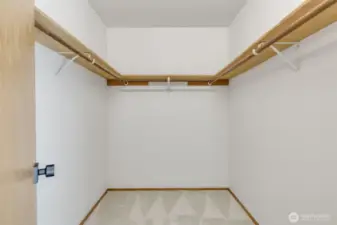 Large walk-in closet attached to bathroom