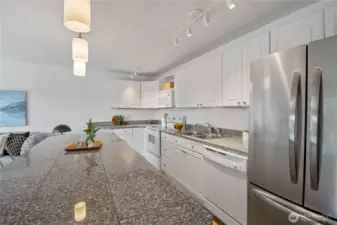 Granite countertops anchor the kitchen with elegance and durability, providing the perfect foundation for your next culinary creation.