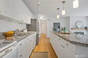 The kitchen flows effortlessly into the rest of the home, creating a functional and harmonious layout ideal for both everyday living and effortless entertaining.