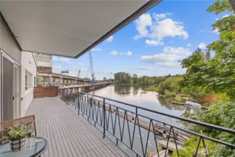 Your picturesque waterscape is right at your fingertips with a spacious 300-square-foot deck—perfect for soaking in sweeping views. Watch boats drift by, kayakers paddle past, and local wildlife like herons and otters make their daily rounds. It’s a front-row seat to the vibrant beauty of waterfront living.