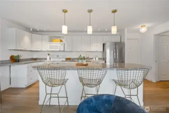 The living area seamlessly connects to the kitchen, offering a cohesive and open layout that’s perfect for hosting and everyday living.