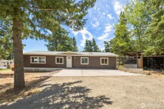 Home has a great concrete parking pad and you could use the shed as a carport for covered parking!