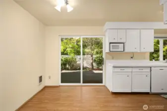 Nice dining space at the end of the kitchen and access to Trex deck through the sliding glass door.