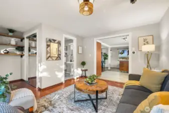 Function meets form with a coat closet just inside the front door, and beautiful shelving units to display books, photos, or treasures!
