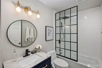 Completely remodeled full bathroom is straight out of a magazine.
