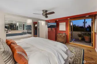 Expansive top floor primary suite with city views patio and rooftop deck