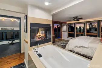 Top floor primary suite with sitting space and rooftop deck and two expansive walk in closets with storage.