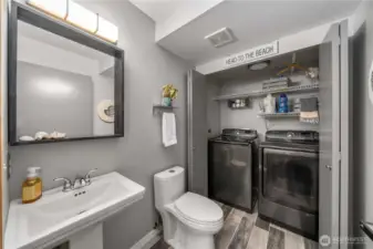 Guest bath located off the entrance with washer and dryer.