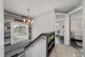 Head upstairs to find three spacious bedrooms .