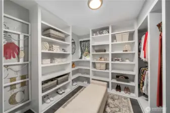 Bedroom no. 4 located on the lower level is being utilized as an impressive walk-in closet for the lower primary suite.