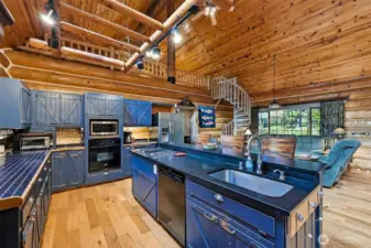 Kitchen with gas cooktop, electric oven, dishwasher and gourmet prep station