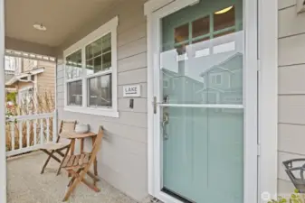 Sip your morning coffee on the cute porch, and come spring & summer, enjoy the floral garden!