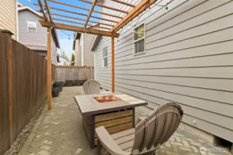 Custom hard-scaping for a low maintenance and fully fenced yard! Enjoy firepit conversation, and there's room for a hot tub!