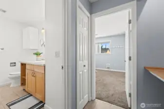 Hallway with room for an office off the bathroom and primary!