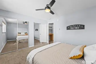 Primary bedroom with mirror closets