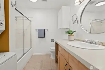 Full bathroom with washer/dryer unit