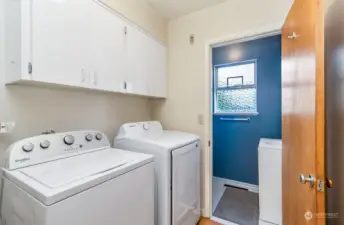 Laundry area with half bath access