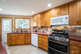 Another great kitchen shot with back door leading to the back patio.