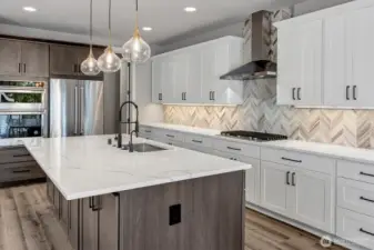 Quartz countertops and tile backsplash