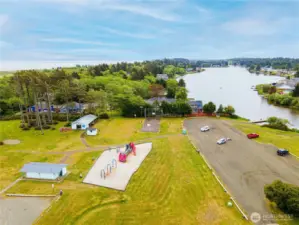 Located next tot he park with the lake and boat launch