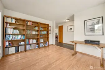 This space balances function and flair effortlessly. Warm wood trim complements durable laminate floors, while the slate tile hallway adds a subtle touch of sophistication. It’s a layout designed for smooth transitions.