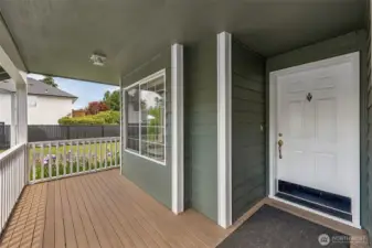 Covered front porch = instant curb appeal and the perfect spot for your seasonal decor dreams. That white 6-panel door with kickplate? Practical meets polished. Plus, the front living room window with pane inserts adds a subtle pop of character.