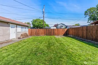 Spacious, fully fenced backyard.