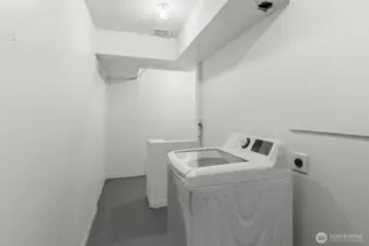 L shaped laundry and storage room just off the interior entrance of the unit. Washer and dryer hook ups inside.