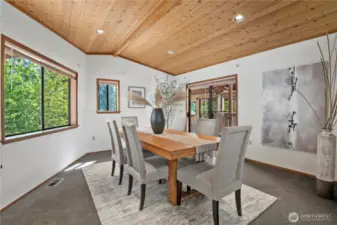 sliding glass door access to covered deck and roof top sun deck and stairs to lower garages/garden yard area