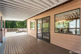 The deck is the center of both wings of the main floor, (no stairs to maneuver) AND makes it possible year-round to BBQ without getting rained . on