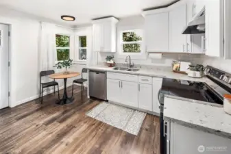 Cooking is a joy in this thoughtfully updated space, complete with quartz-style counters, subway tile backsplash, and a cozy breakfast nook.