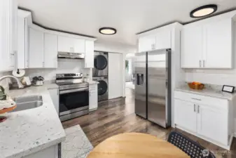 The seamless flow between cooking, dining, and storage creates a kitchen that feels as practical as it is inviting.