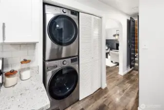 A clever layout combines kitchen, dining, and laundry—streamlining daily routines while keeping everything within easy reach.