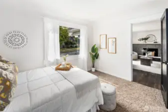 Steps from the living room, this front bedroom offers charm, convenience, and a peaceful view of the neighborhood.