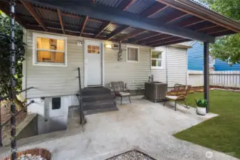 Covered patio just off the kitchen—ideal for morning coffee or hosting summer BBQs rain or shine.