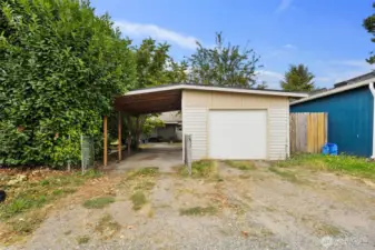 Detached garage with alley access makes parking and storage simple. Excellent DADU potential with garage and carport conversion.
