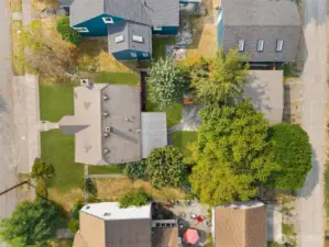 Bird’s-eye view shows the full property with covered patio, detached garage, and alley access, your own private retreat in the heart of the neighborhood.