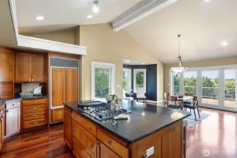 At the heart of the home is the tastefully designed kitchen, where Brazilian Cherry cabinetry pairs elegantly with gleaming granite countertops.