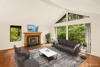 Living room with cozy fireplace.  Virtually staged.