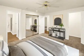 Primary bedroom with bathroom and walk-in shower. Virtually staged.