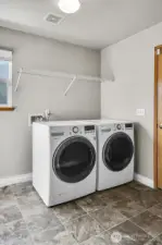 Laundry room with garage entrance on right