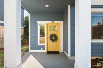 The covered patio leads to the front door and formal entry.