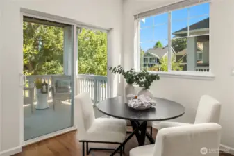 A gracious dining room looks out over the covered bbq porch.