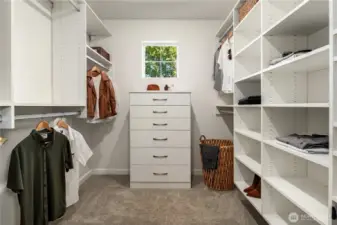 This spacious walk-in closet features custom built-ins and lots of storage.