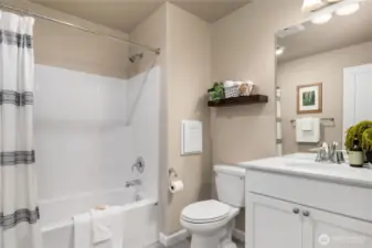 Another full bath (4 baths in total) located downstairs.