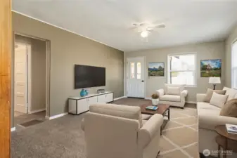 Living Room and front entry door facing East (virtual staging)