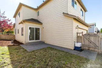 Fully fenced backyard with gate to garage