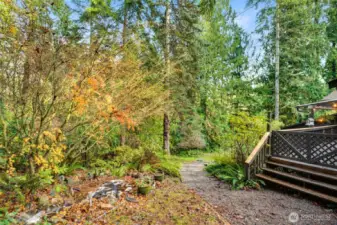 Second back deck access with path to lower patio and second garage entrance