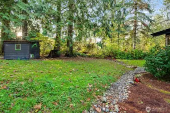 Front yard space with rock river