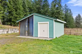 Well house provides more storage - other side could be used as a small loafing shed.
